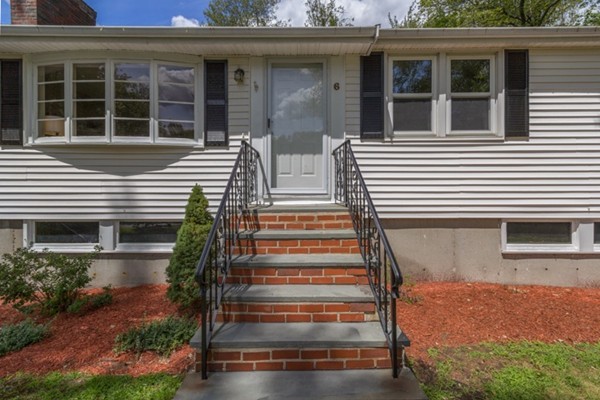 6 Hanson Road Wilmington, MA 01887 - Photo 3 of 29 a front view of house with a garden