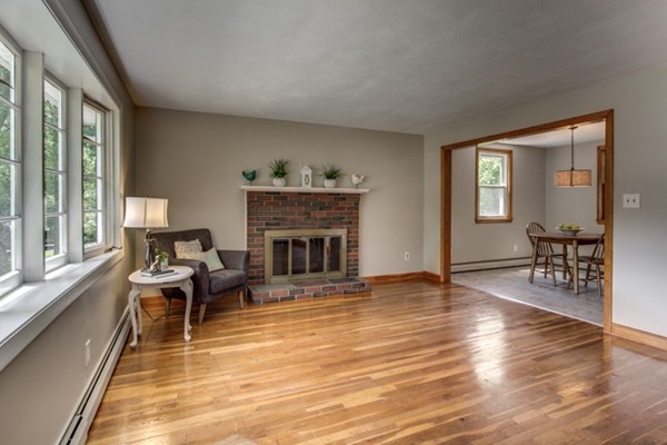 6 Hanson Road Wilmington, MA 01887 - Photo 6 of 29 a living room with furniture and a fireplace