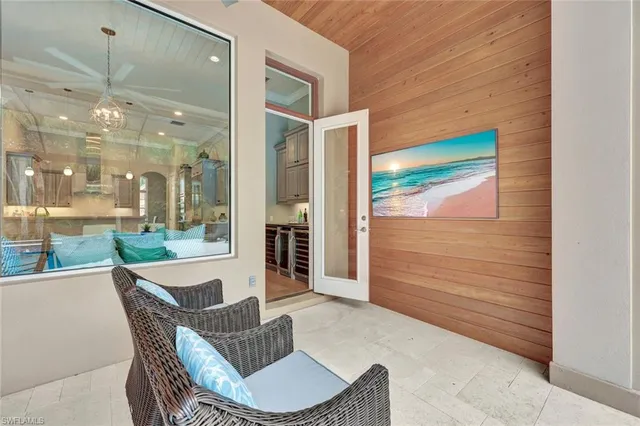 a outdoor space with patio furniture and glass windows