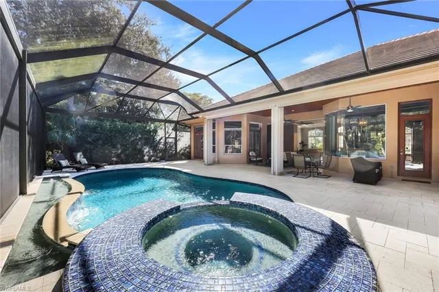 a swimming pool with outdoor seating