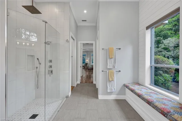 a bathroom with a tub shower and sink