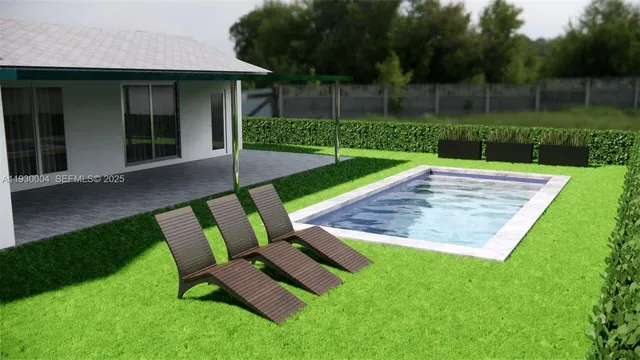 a view of a chair and table in backyard of the house