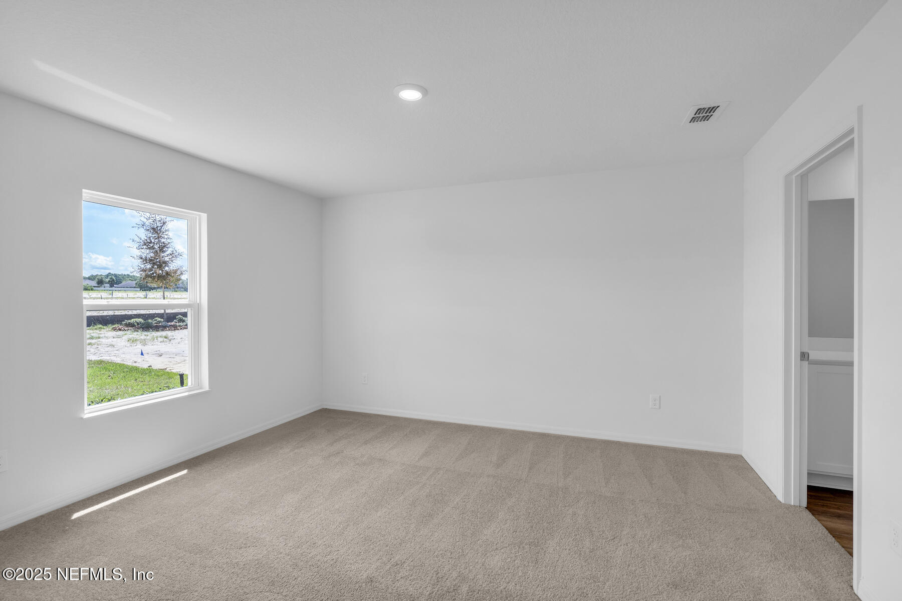 37151 Whippoorwill Court Hilliard, FL 32046 - Photo 11 of 19 an empty room with windows