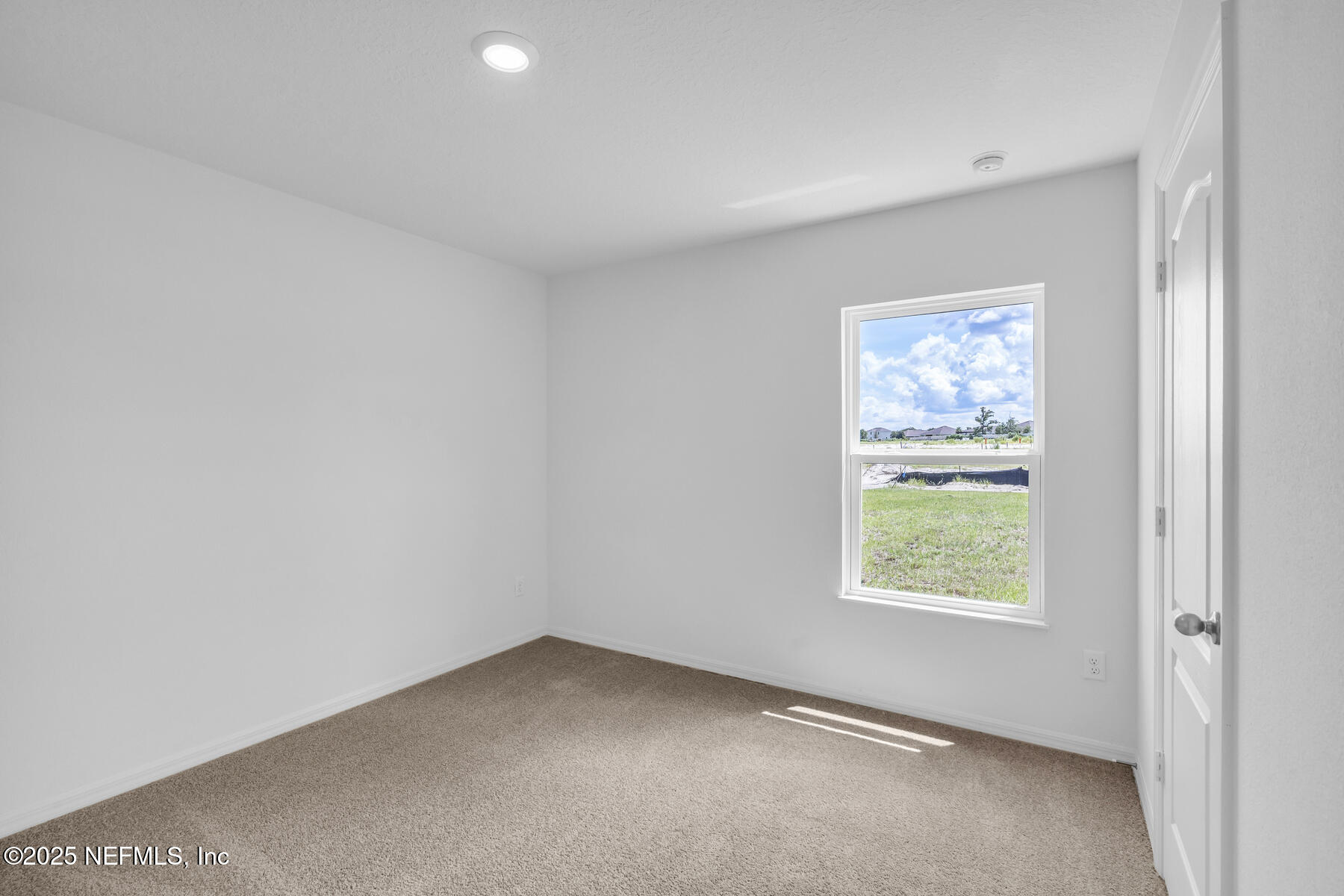 37151 Whippoorwill Court Hilliard, FL 32046 - Photo 16 of 19 an empty room with a window