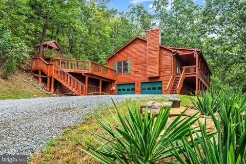 a balcony with furniture and a potted plant