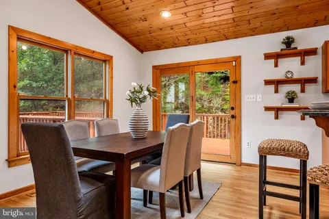 a bedroom with a large bed closet and flat screen tv