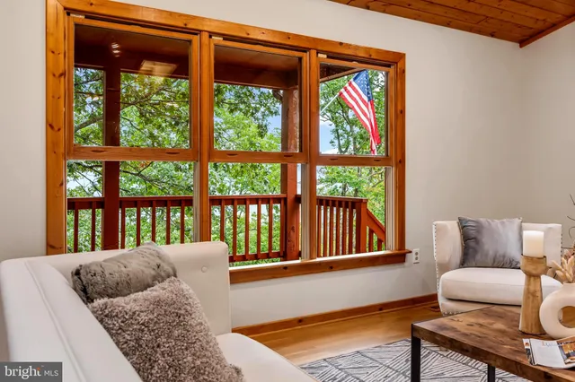 a bathroom with a sink a toilet a mirror and bathtub