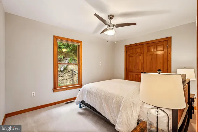 a bathroom with a sink toilet a mirror and shower