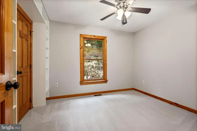 a balcony with trees in front of it