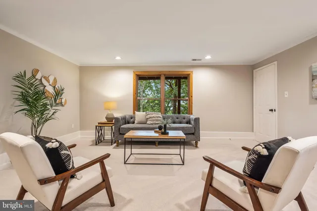 an aerial view of a house with a yard and outdoor seating
