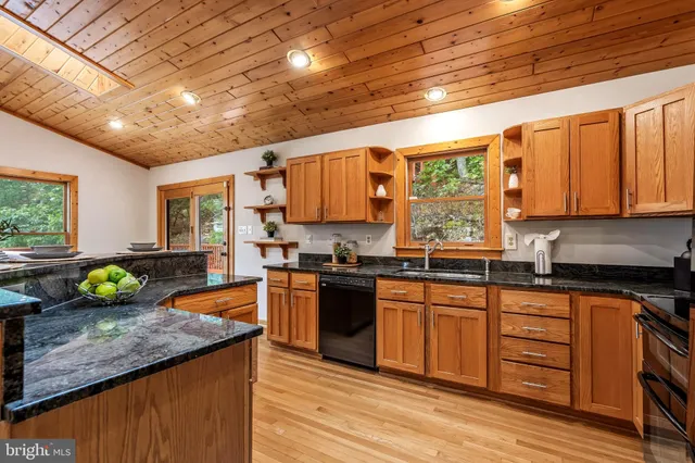 a spacious bedroom with a bed and a large window