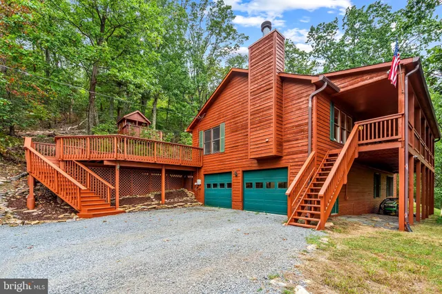 a view of balcony with wooden floor and fence