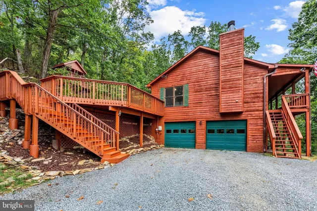 a side view of a house with a yard