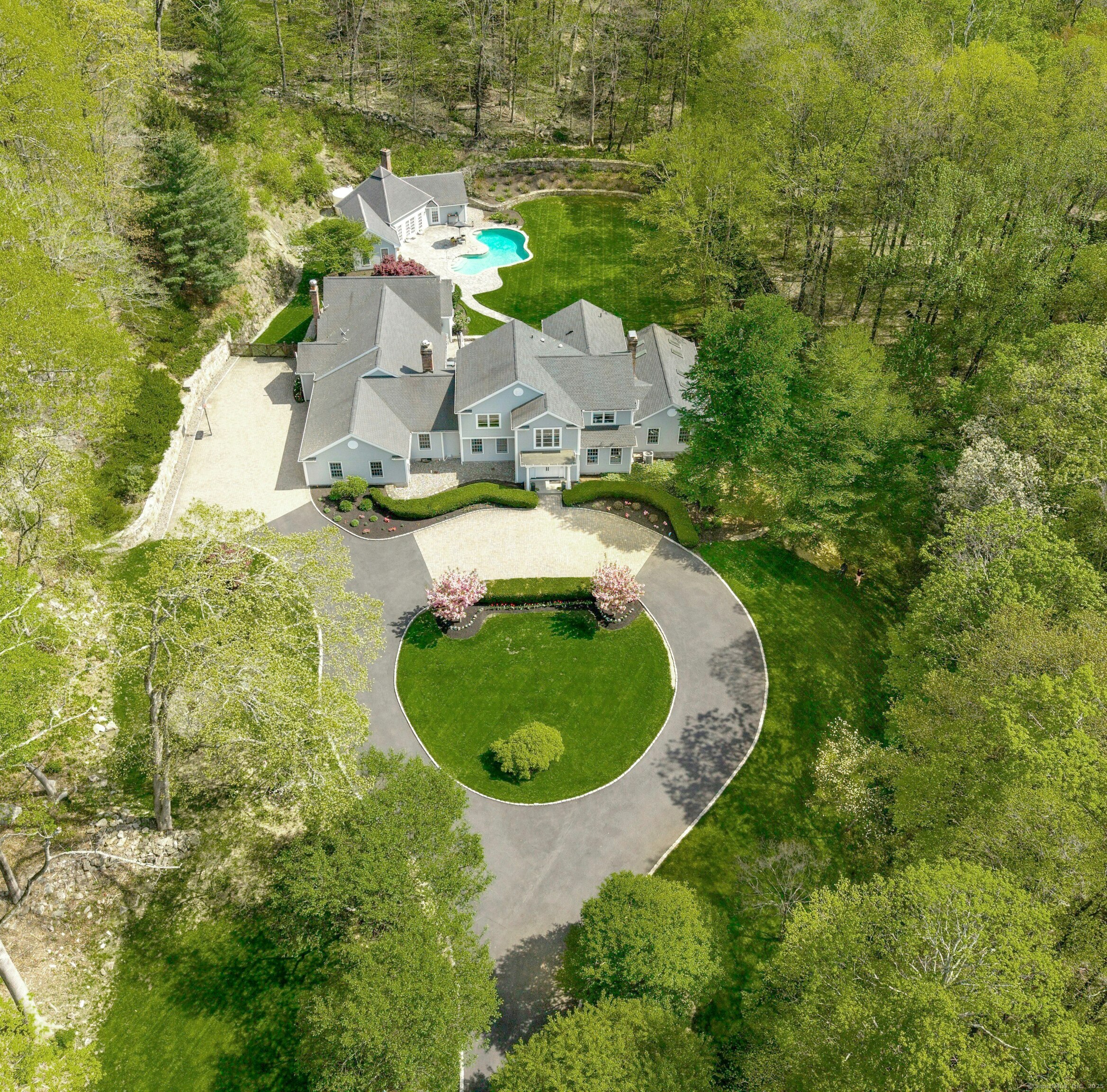 This private estate features a Main House and Guest House both oriented around a central courtyard with gunite pool.
