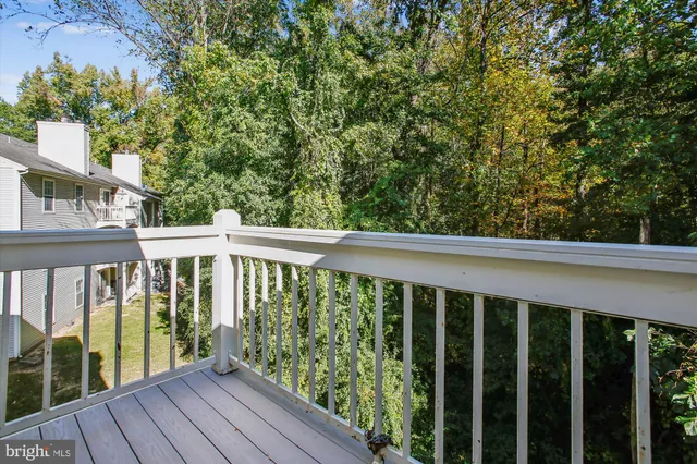 a view of a balcony with wooden floor