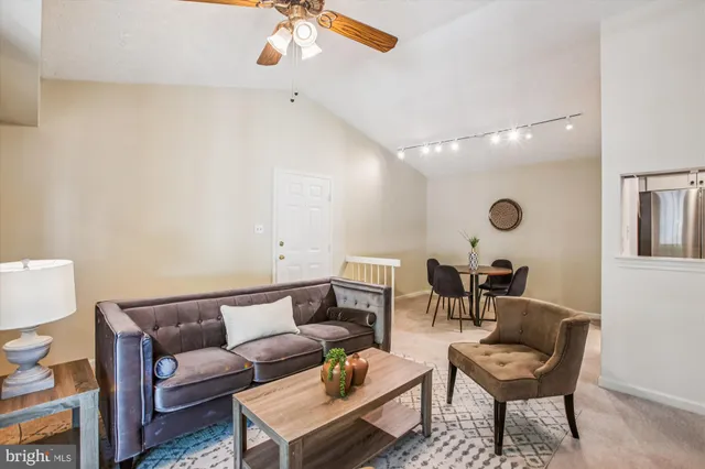 a living room with furniture and a chair