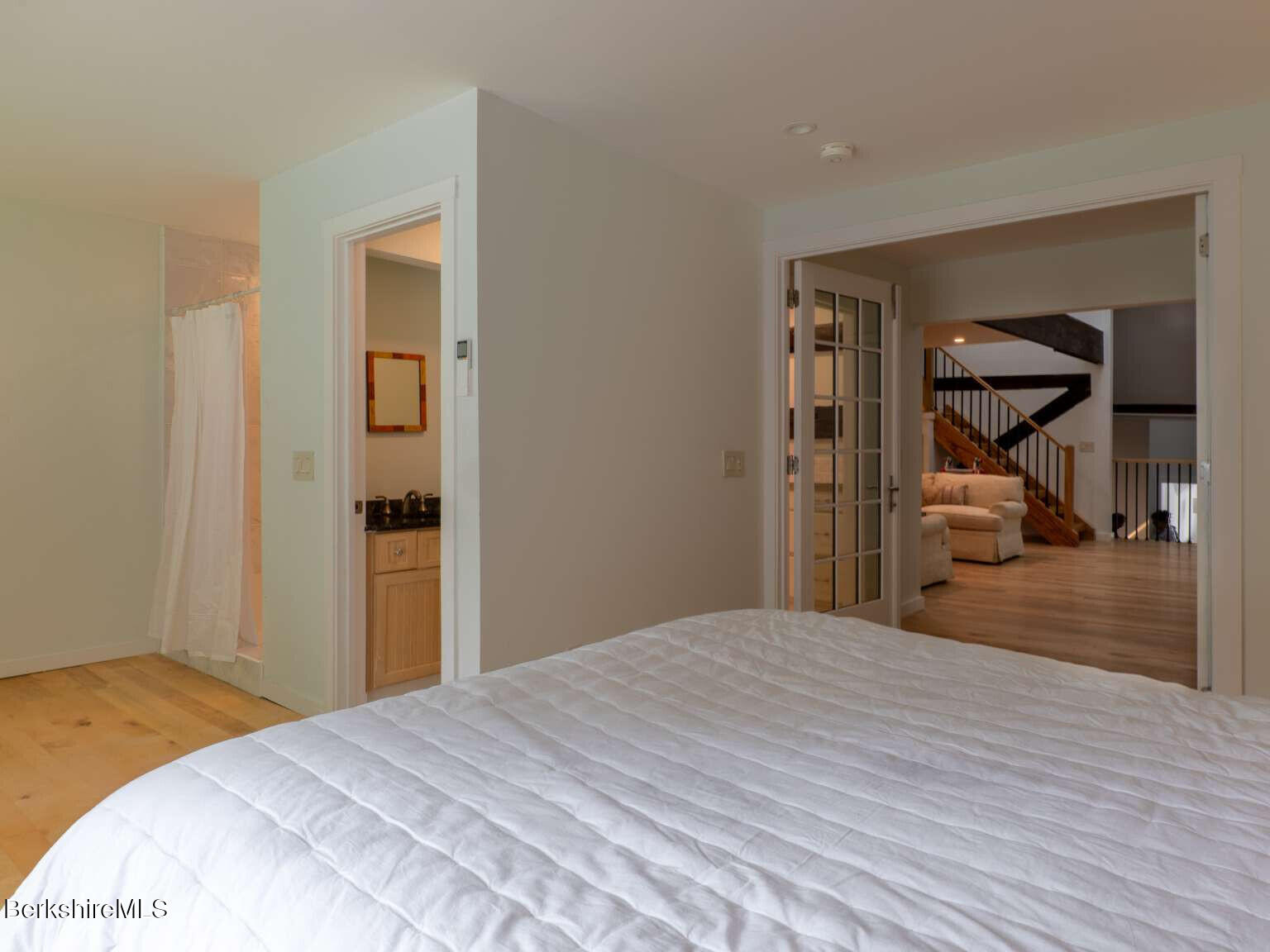 160 High Street Lee, MA 01238 - Photo 28 of 41 a bedroom with a bed and a mirror