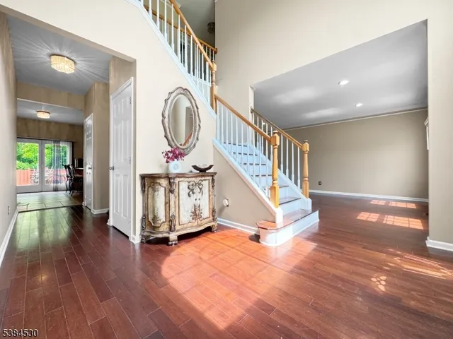 a view of entryway with wooden floor
