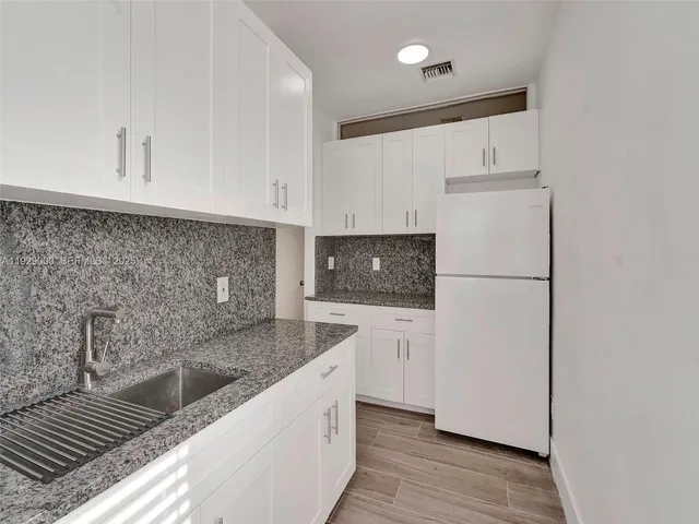 a bathroom with a toilet a sink and a bathtub