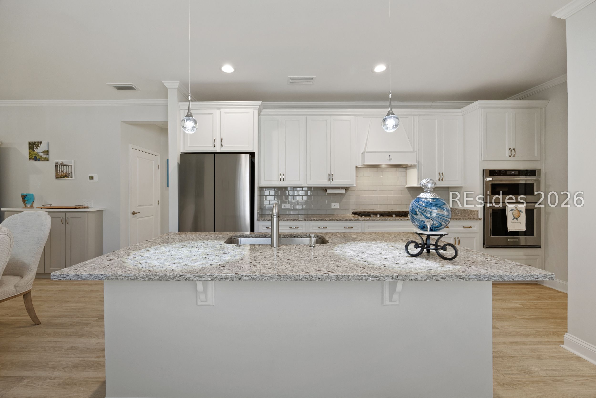 506 Destiny Drive Bluffton, SC 29909 - Photo 11 of 66 Recessed lighting and custom island pendants.