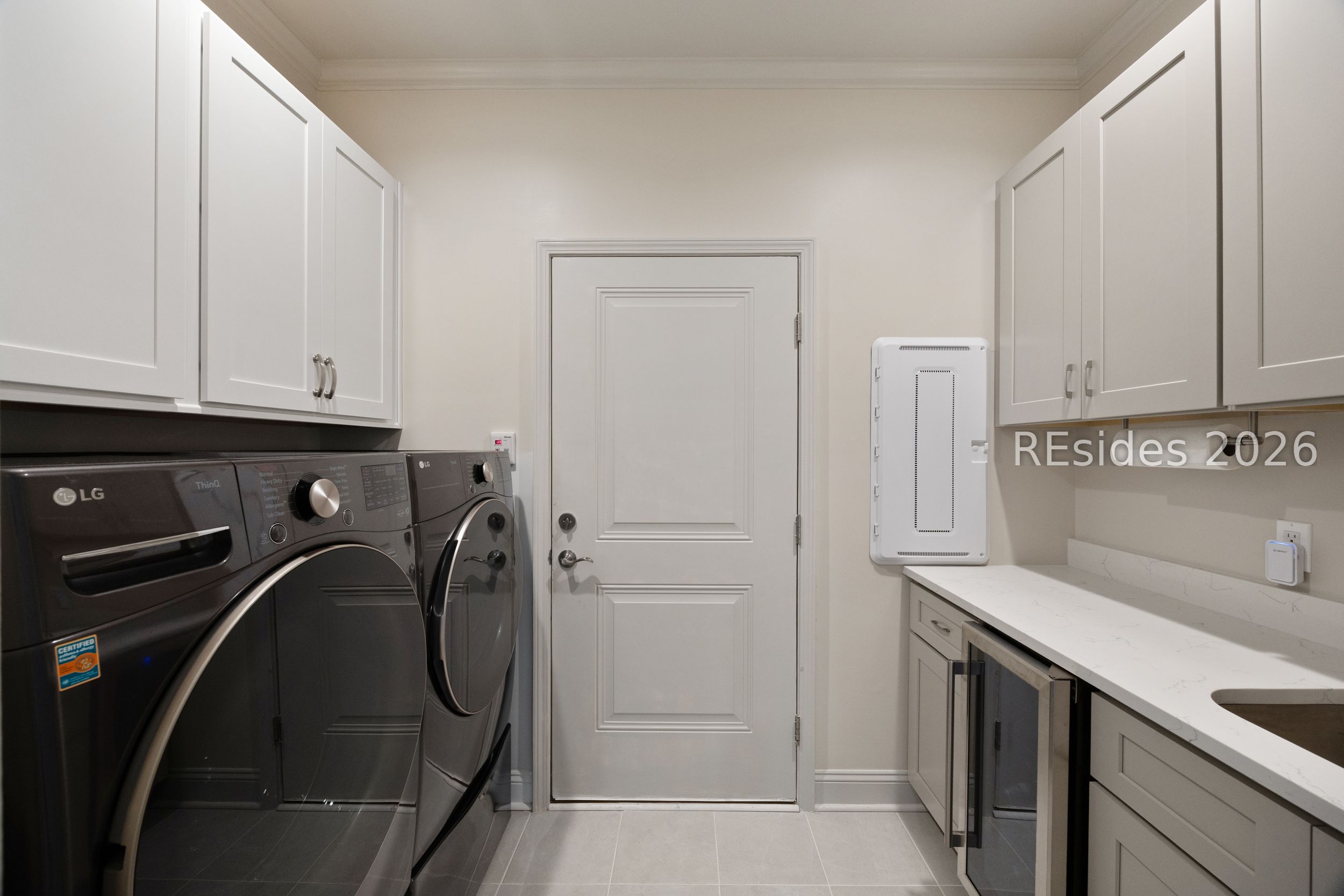 506 Destiny Drive Bluffton, SC 29909 - Photo 25 of 66 Washer and dryer with cabinetry above for storage.
