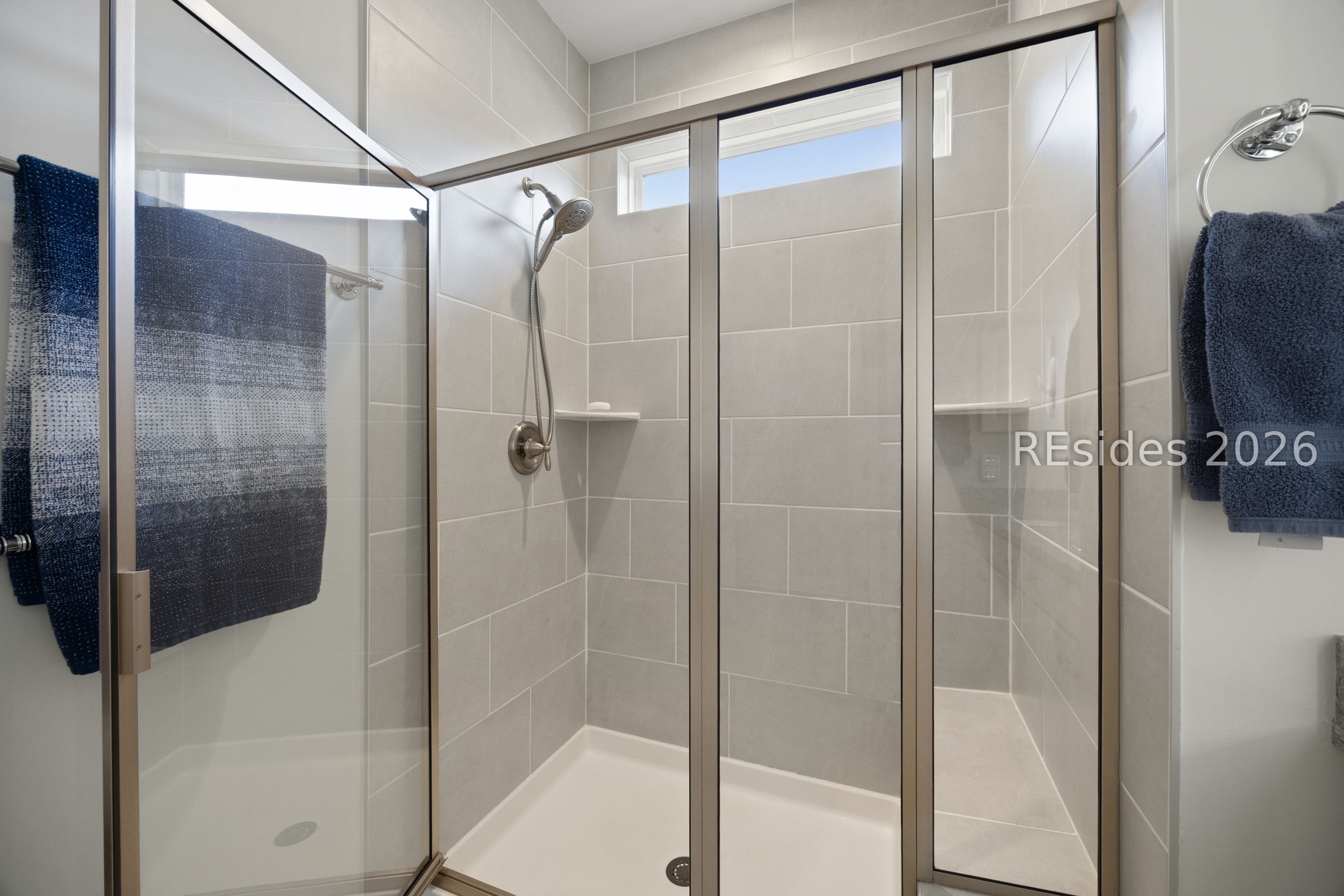 506 Destiny Drive Bluffton, SC 29909 - Photo 44 of 66 Tile walk-in shower with a bench.