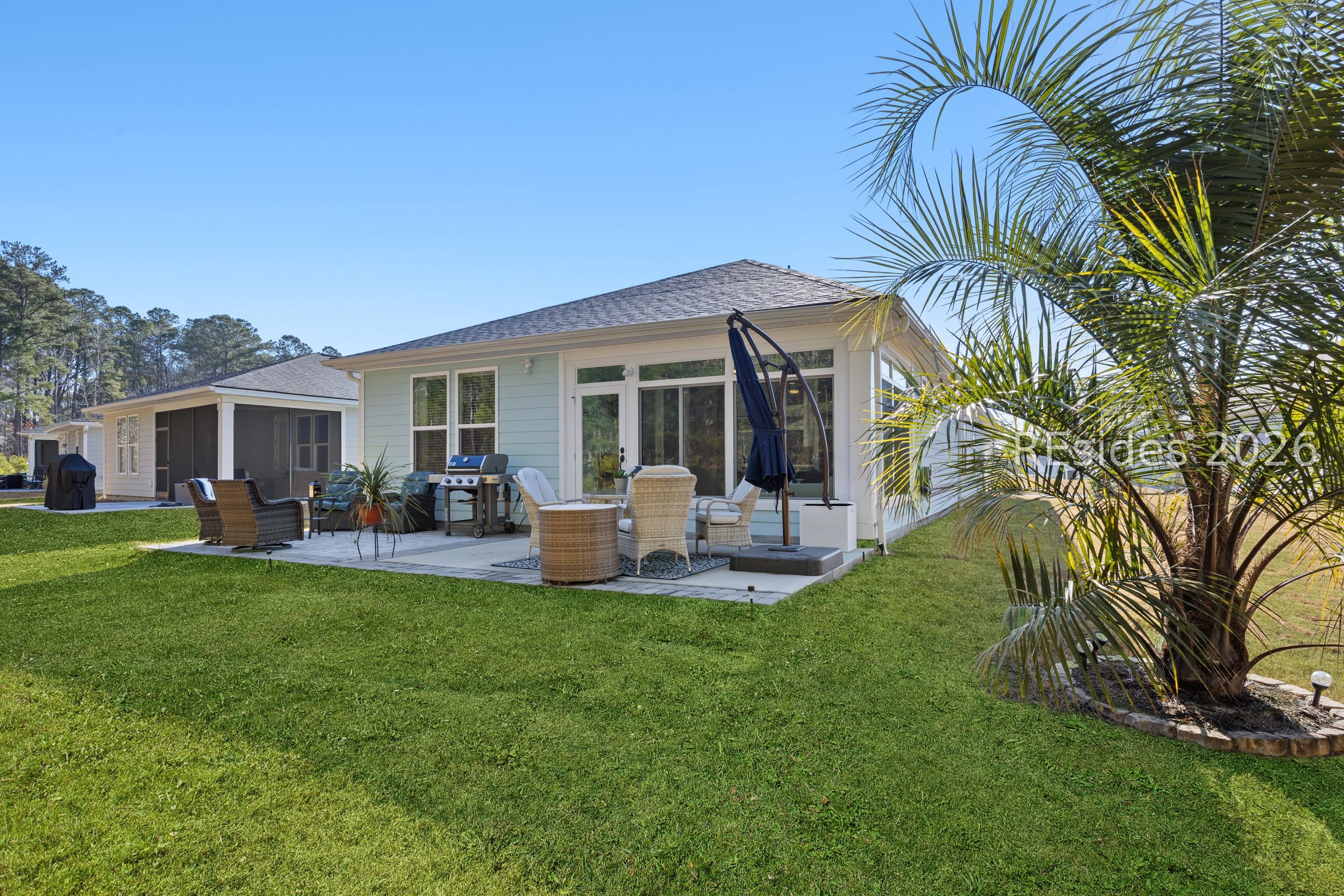 506 Destiny Drive Bluffton, SC 29909 - Photo 60 of 66 Custom landscaped bed with palm.