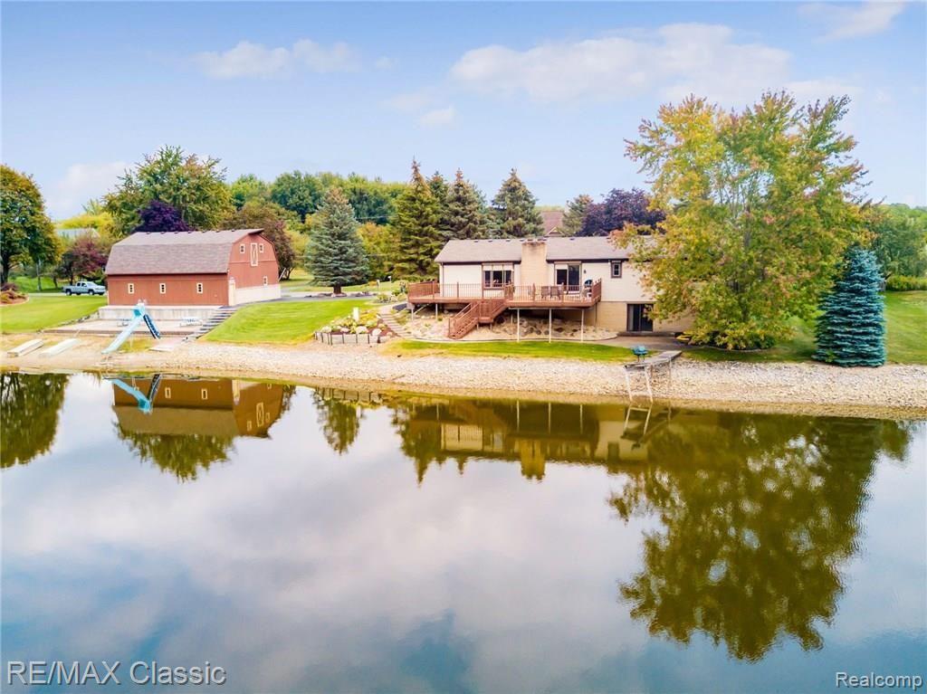 21801 Garfield Road Northville, MI 48167 - Photo 6 of 29 Rear View of House and Barn from the West side of the lake.