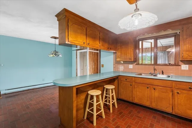 a kitchen with a sink and cabinets