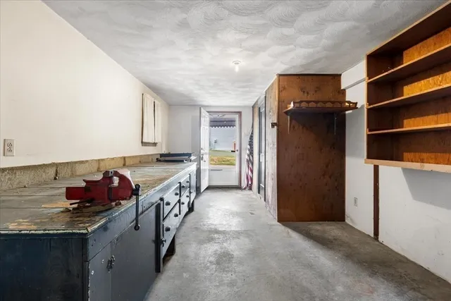 a kitchen with a refrigerator and a sink