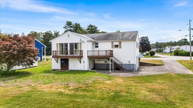 a view of a house with a yard porch and sitting area
