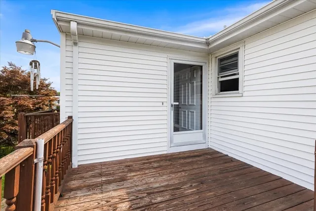 a view of a porch with wooden floor