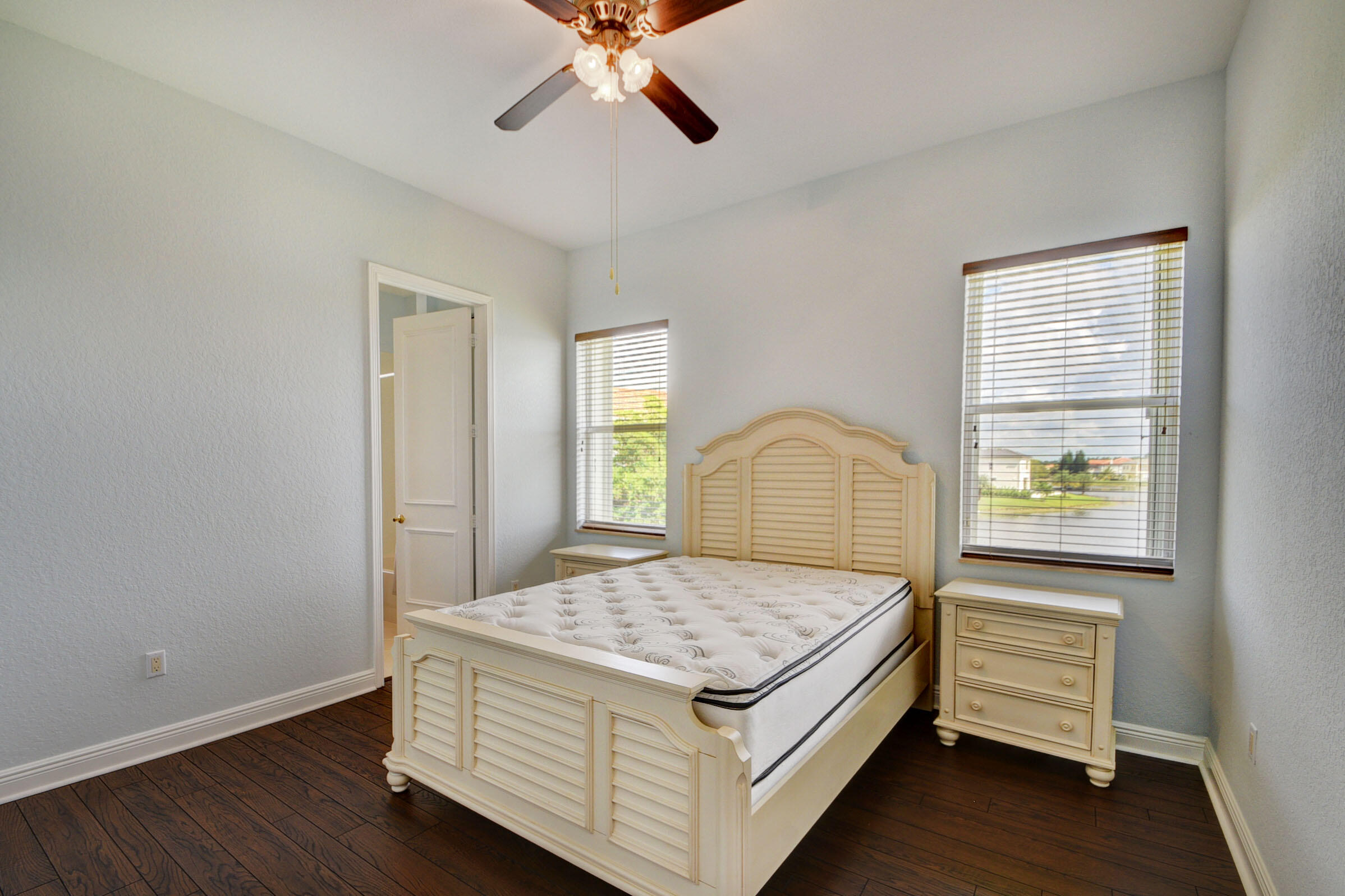 2742 Treanor Terrace Wellington, FL 33414 - Photo 13 of 44 a bedroom with a bed and a window