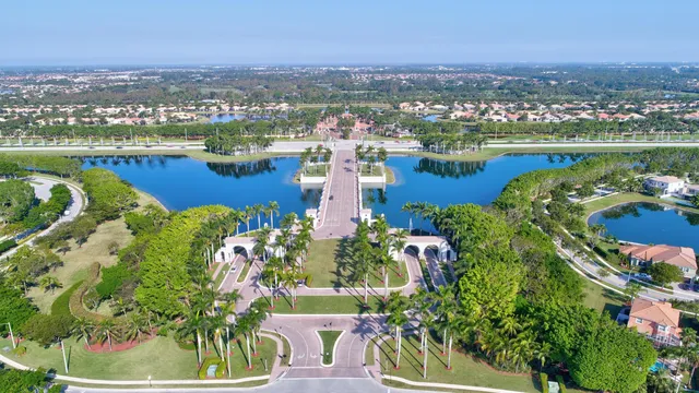 an aerial view of residential house with outdoor space and swimming pool