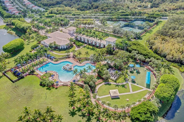 an aerial view of a house with a lake view