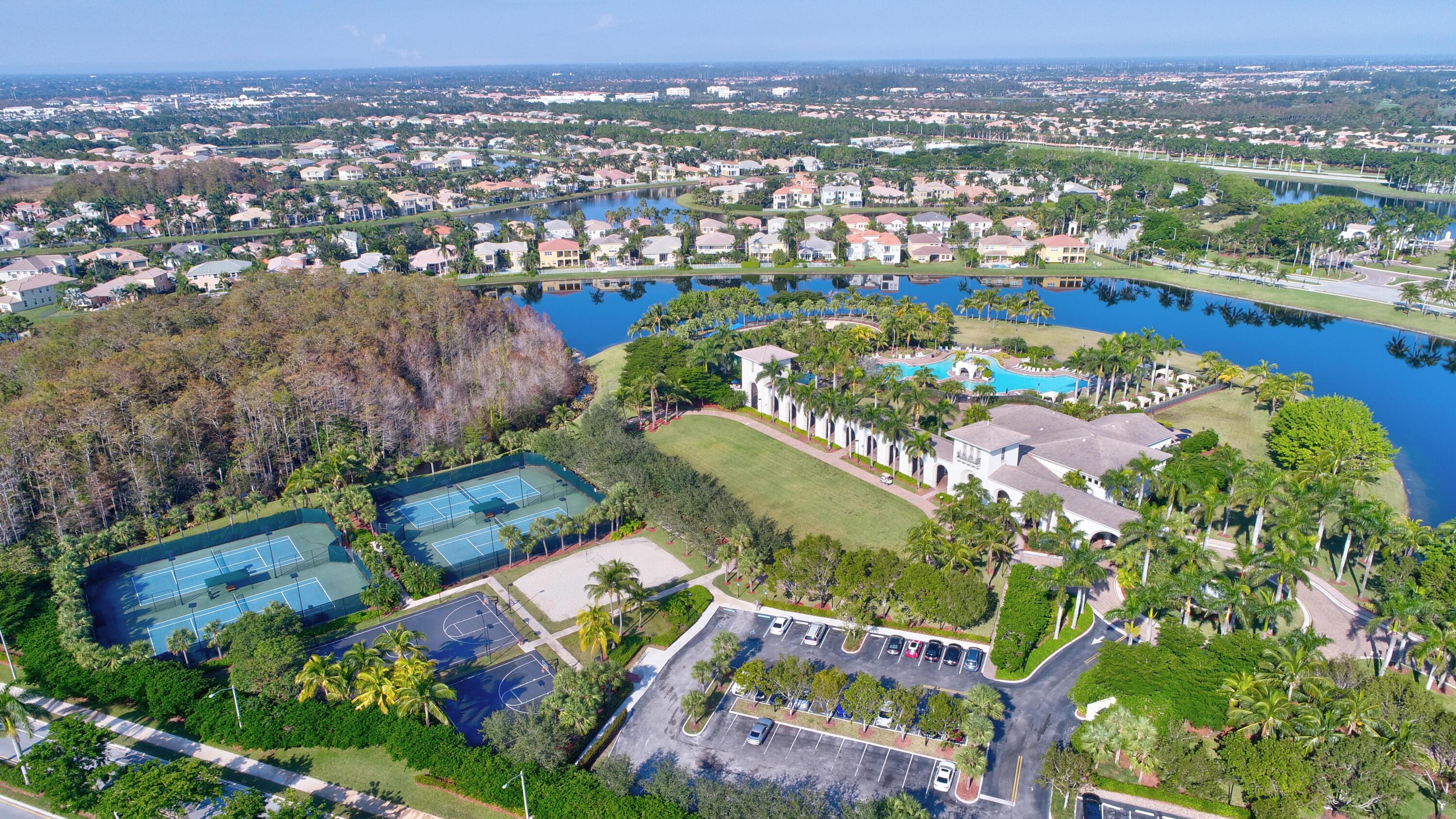 2742 Treanor Terrace Wellington, FL 33414 - Photo 25 of 44 an aerial view of residential houses with outdoor space and trees
