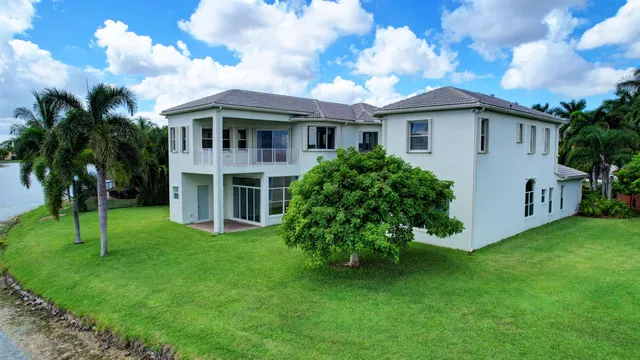 a living room with furniture gym equipment and a chandelier