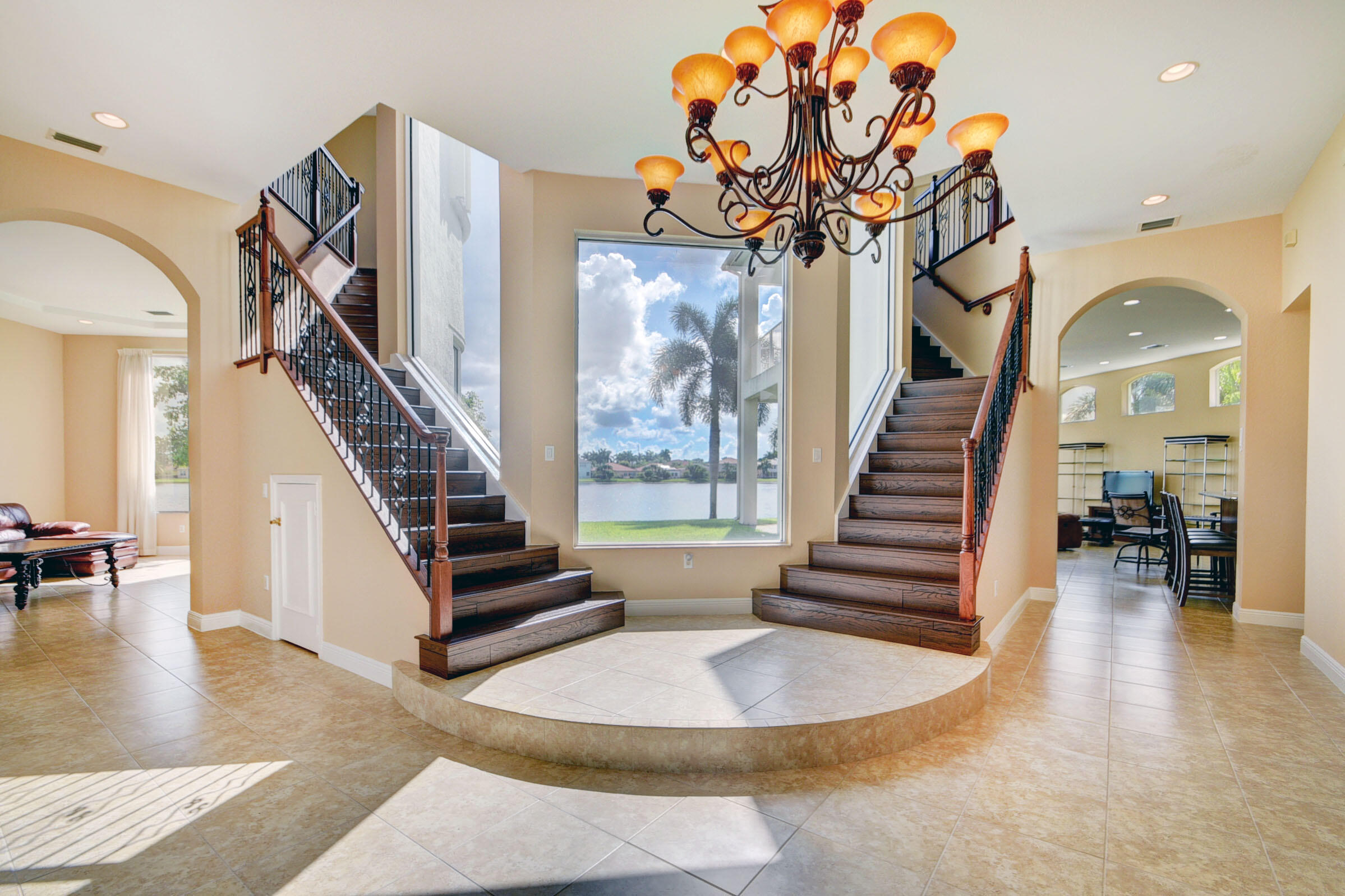 2742 Treanor Terrace Wellington, FL 33414 - Photo 3 of 44 a view of entryway and hall with wooden floor