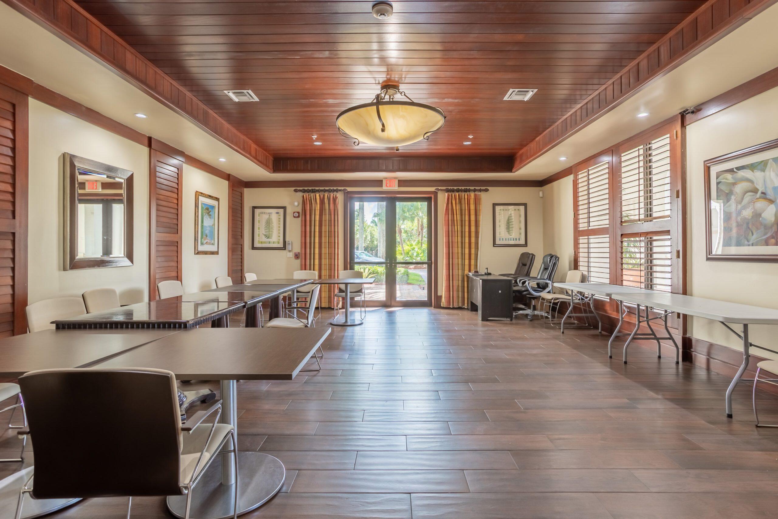 2742 Treanor Terrace Wellington, FL 33414 - Photo 39 of 44 a very nice looking dining room with lots of furniture wooden floor and floor to ceiling window