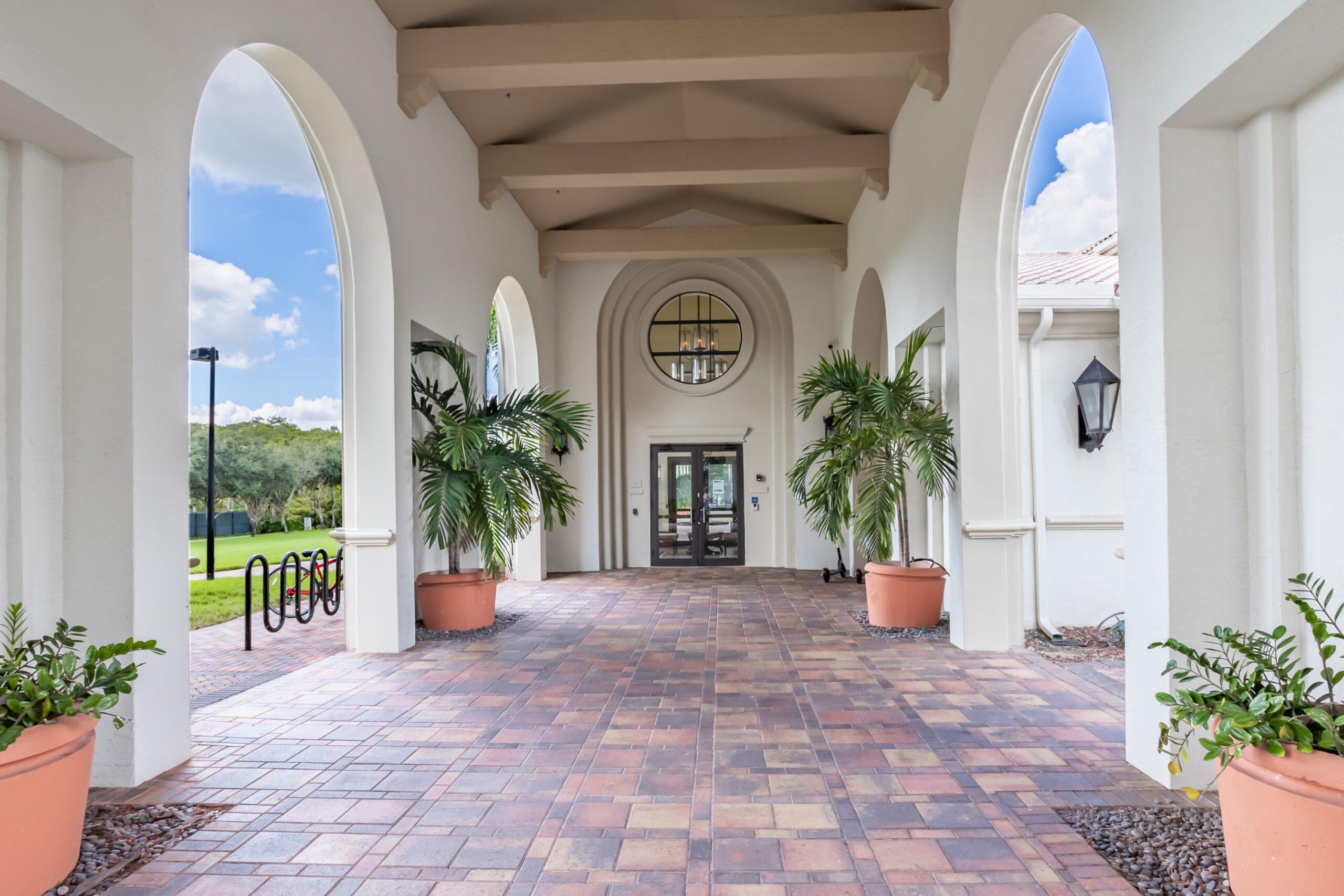 2742 Treanor Terrace Wellington, FL 33414 - Photo 40 of 44 a view of entryway and hall with wooden floor