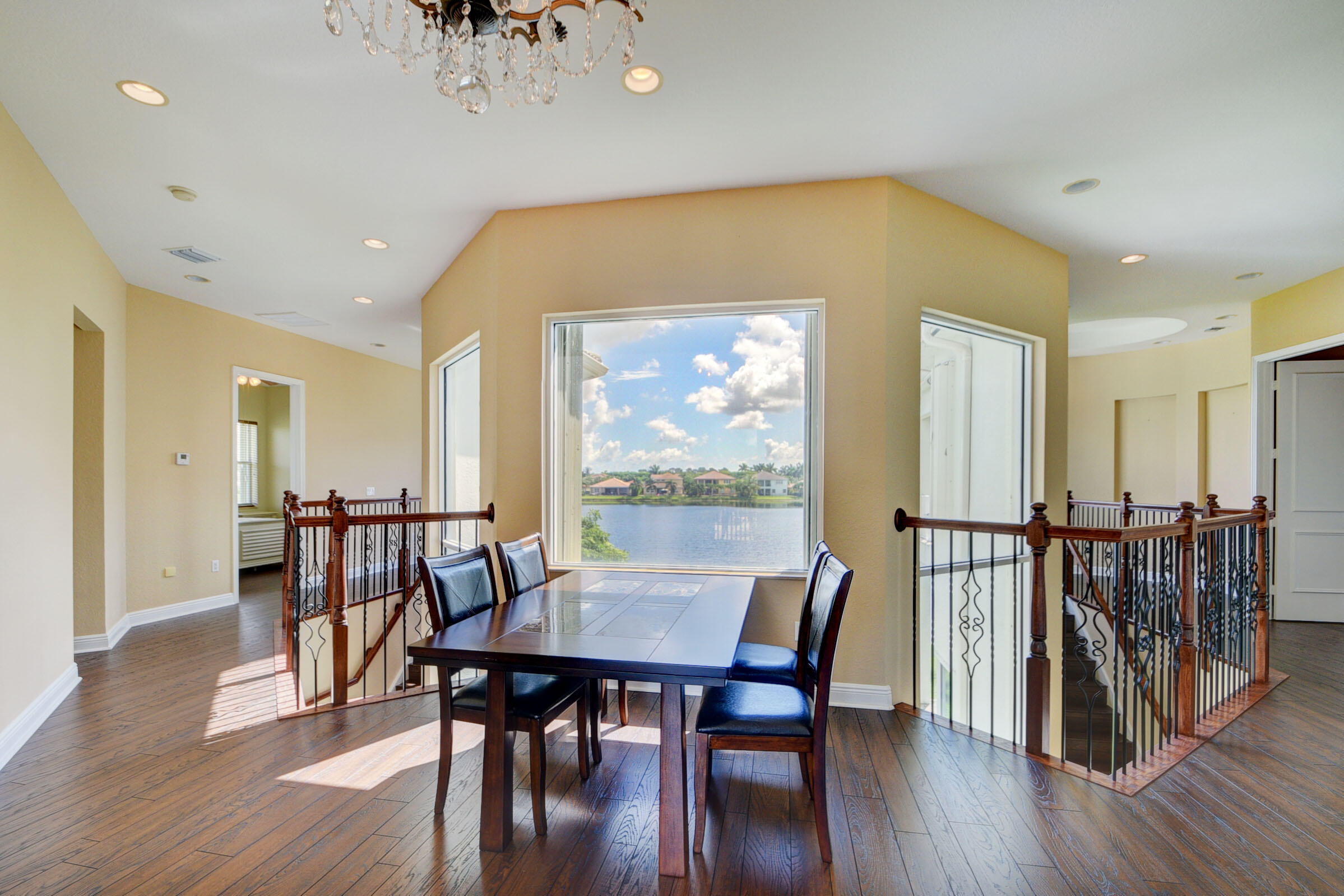 2742 Treanor Terrace Wellington, FL 33414 - Photo 5 of 44 a view of a dining room with furniture and wooden floor