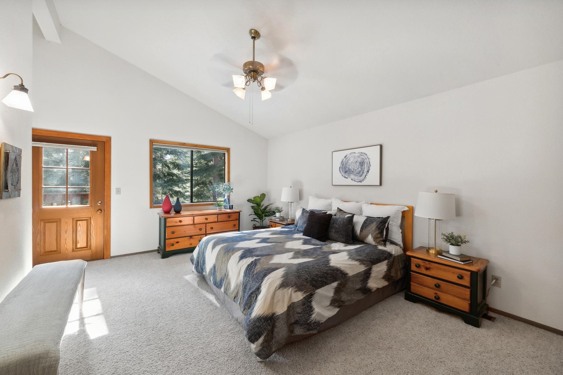 11400 Sitzmark Way Truckee, CA 96161 - Photo 15 of 21 a spacious bedroom with a bed and a chandelier