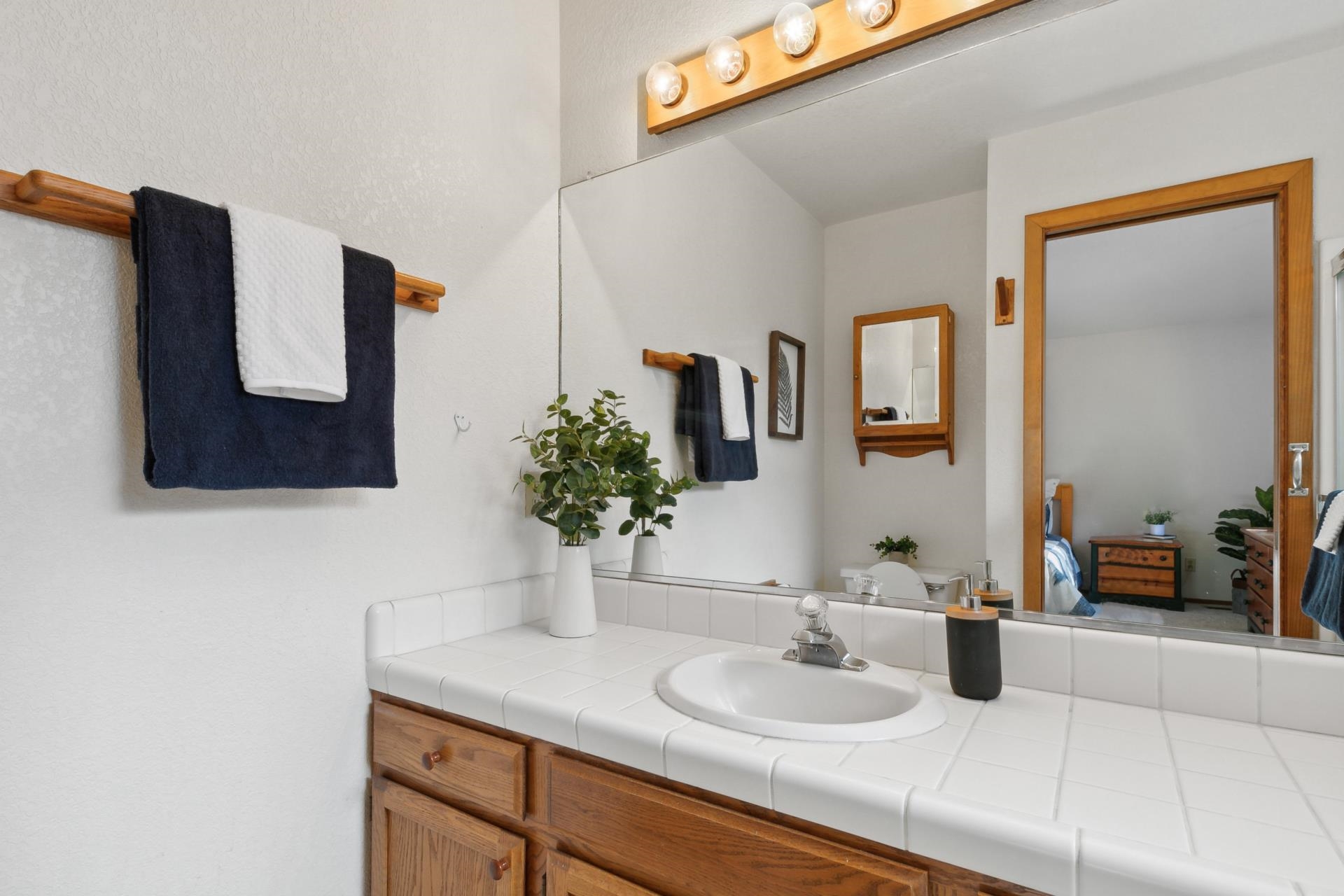 11400 Sitzmark Way Truckee, CA 96161 - Photo 16 of 21 a bathroom with a sink and a mirror