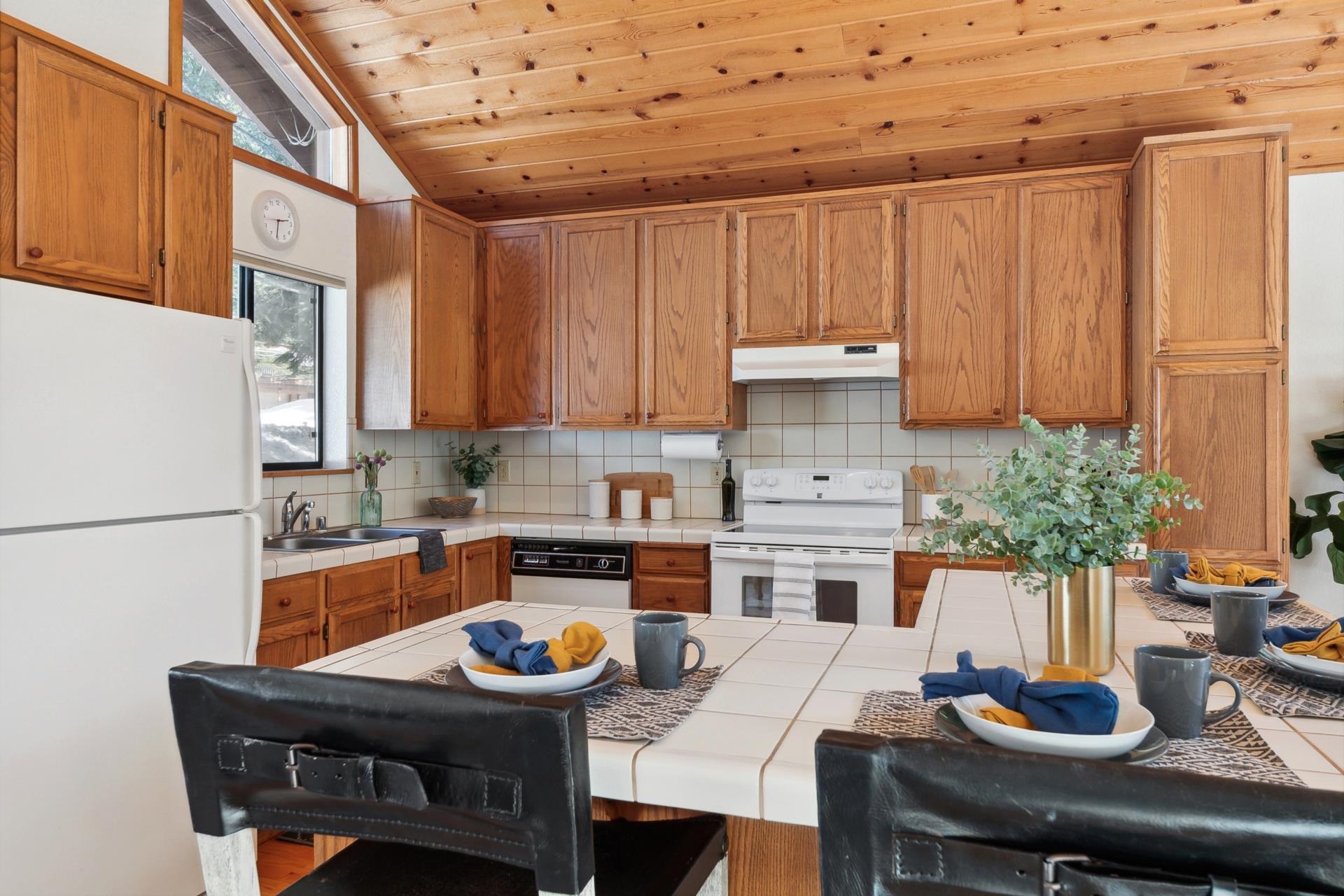 11400 Sitzmark Way Truckee, CA 96161 - Photo 10 of 21 a kitchen with a table chairs and a refrigerator