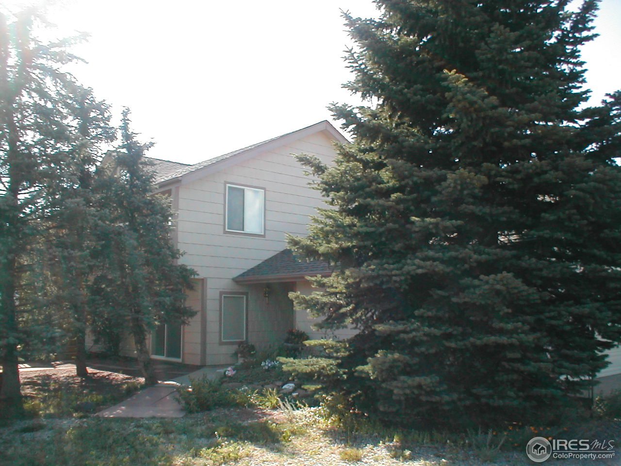 145 Apple Ridge Road Lyons, CO 80540 - Photo 8 of 12 a backyard of a house with lots of green space