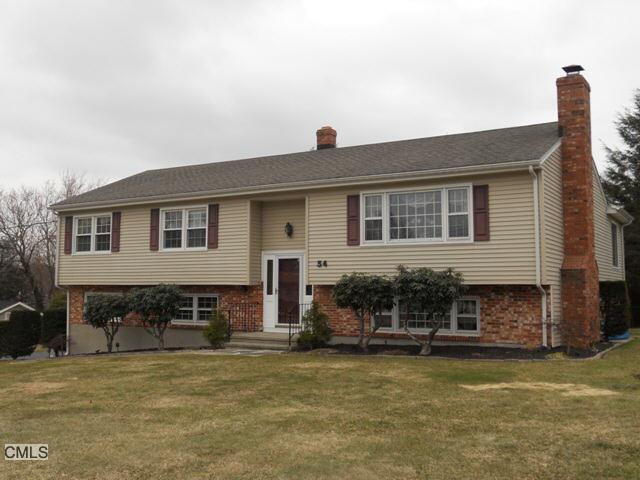 54 Zephyr Road Trumbull, CT 06611 - Photo 1 of 1 a front view of a house with a yard