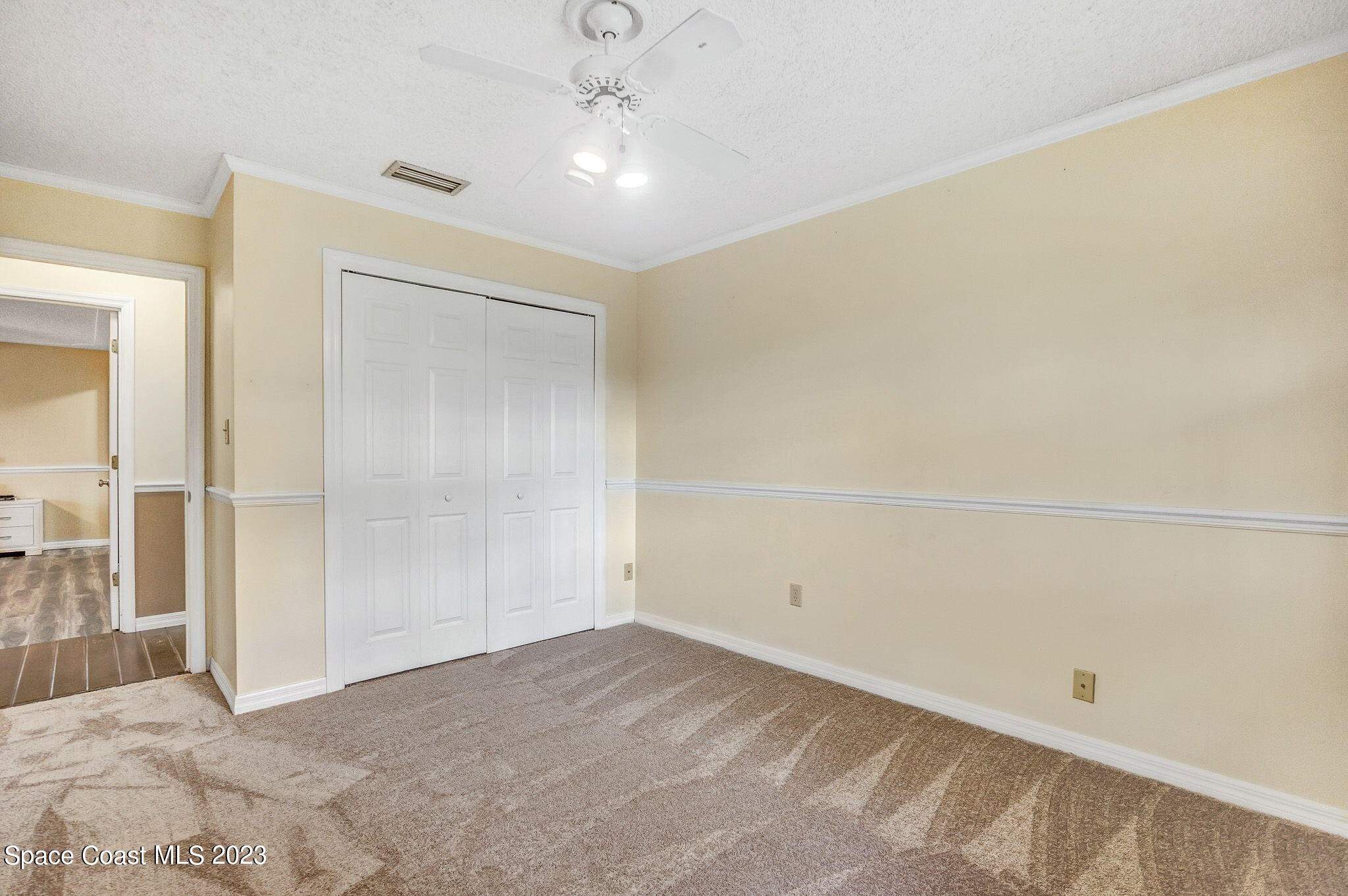 2281 Friday Road Cocoa, FL 32926 - Photo 13 of 72 an empty room with an entryway and fan