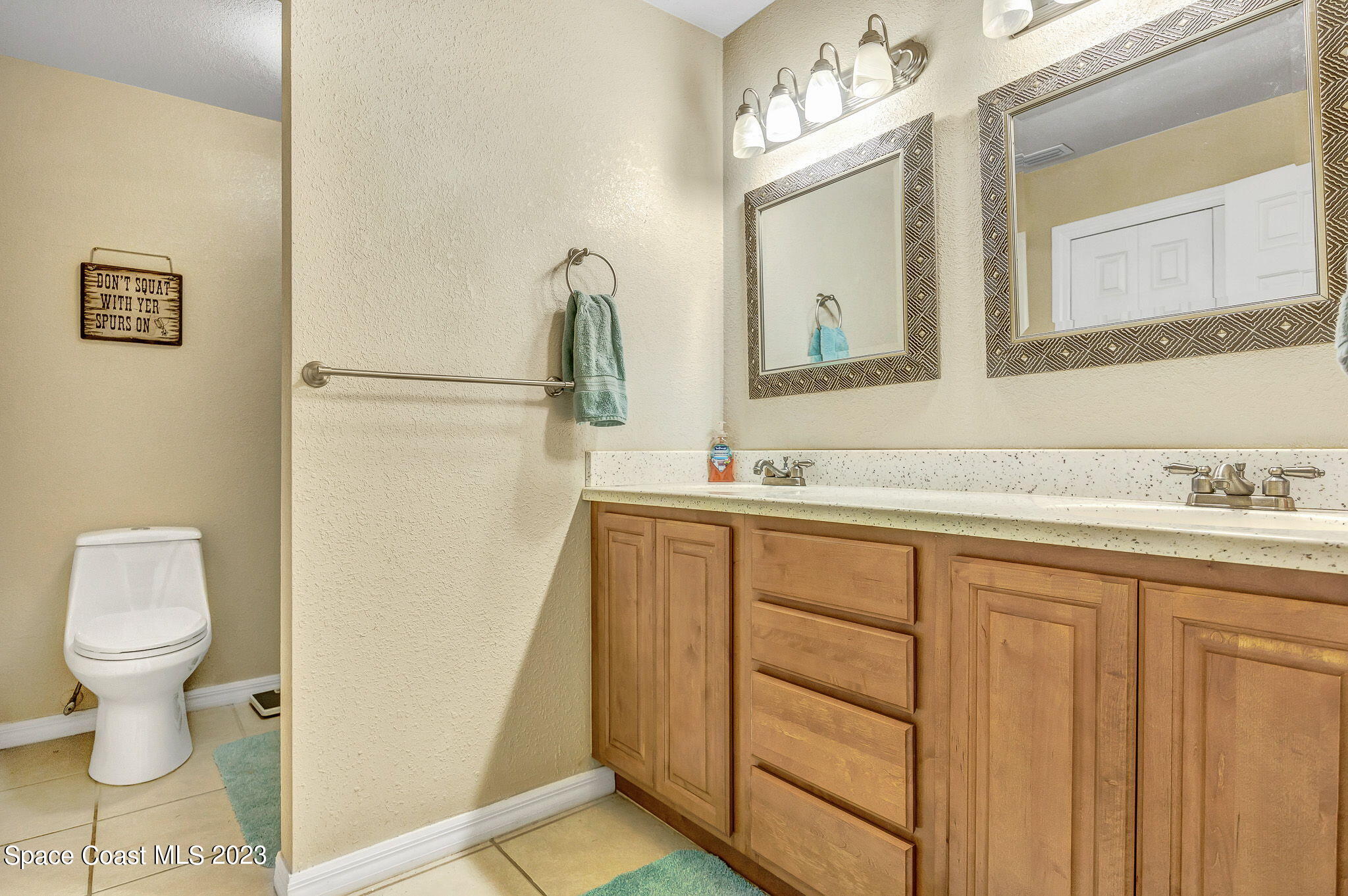 2281 Friday Road Cocoa, FL 32926 - Photo 15 of 72 a bathroom with a sink and a mirror