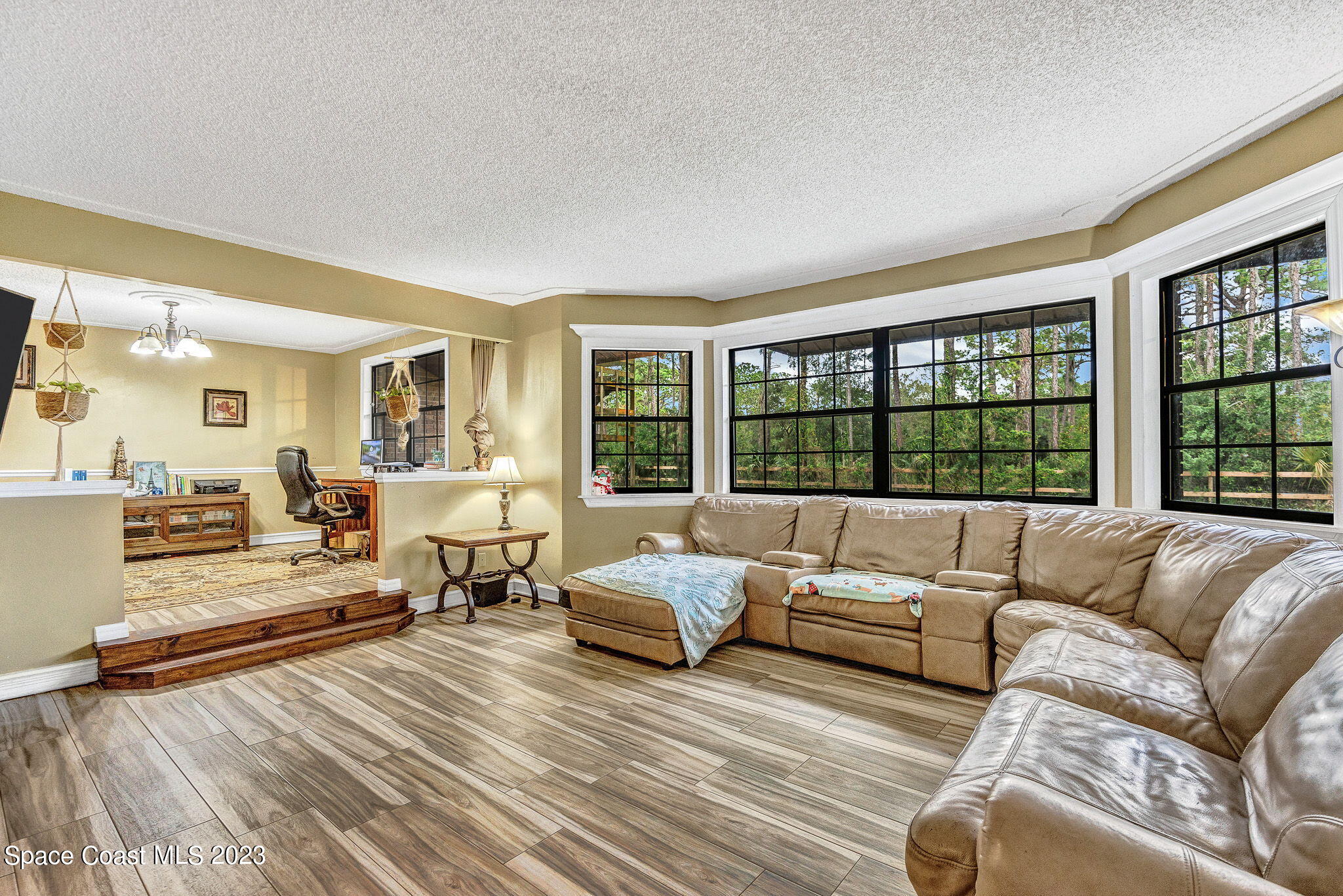 2281 Friday Road Cocoa, FL 32926 - Photo 16 of 72 a living room with furniture and a large window