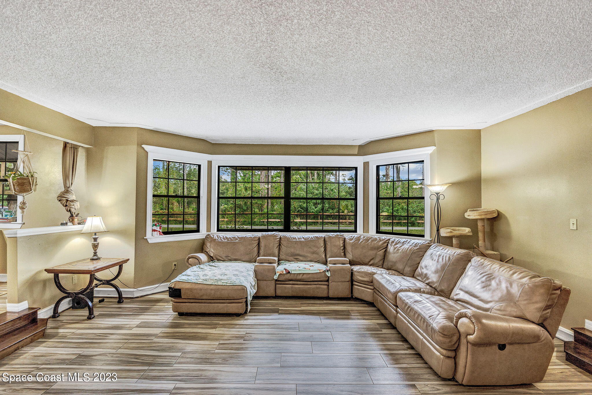 2281 Friday Road Cocoa, FL 32926 - Photo 18 of 72 a living room with furniture and a large window